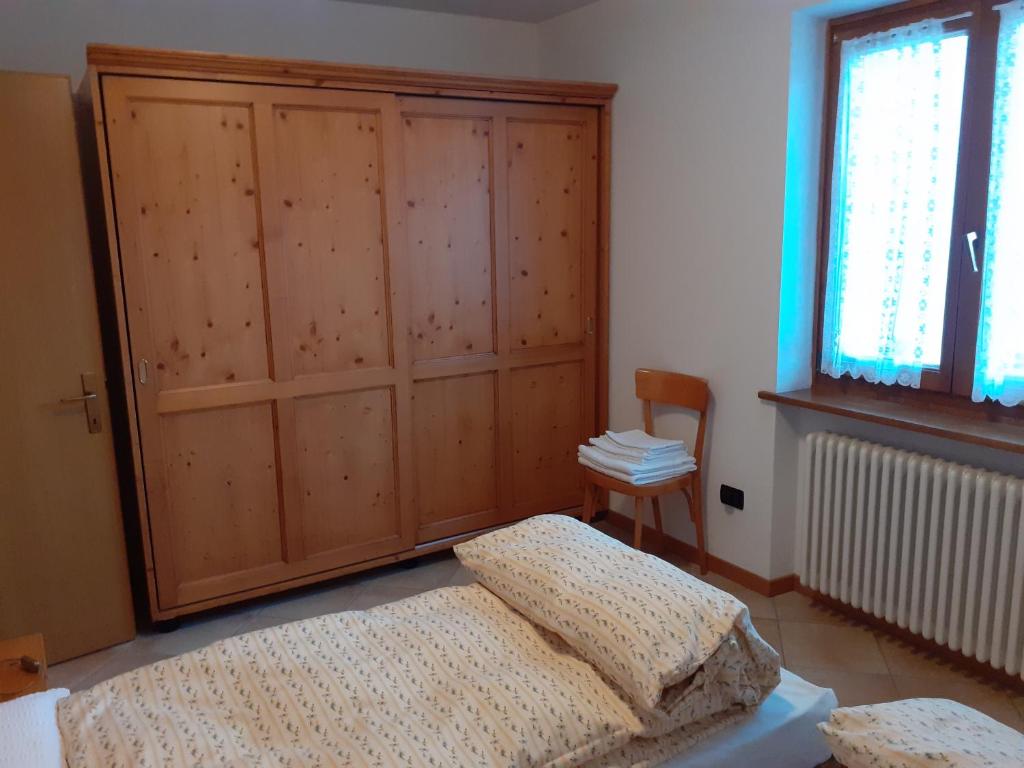 Postel nebo postele na pokoji v ubytování Appartamenti Rumo