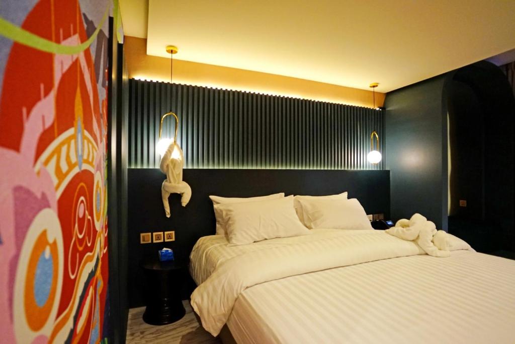 Postel nebo postele na pokoji v ubytování 4 Monkeys Hotel