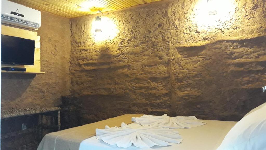 Postel nebo postele na pokoji v ubytování Casa do Sertão - Vila Aju