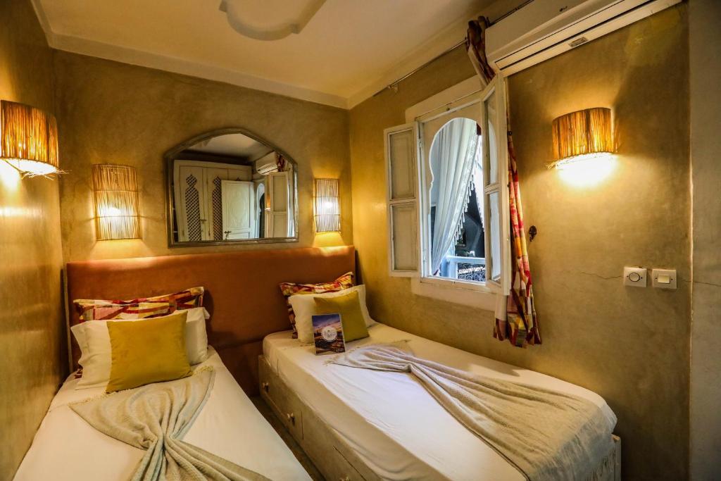Postel nebo postele na pokoji v ubytování Riad les 2 Portes