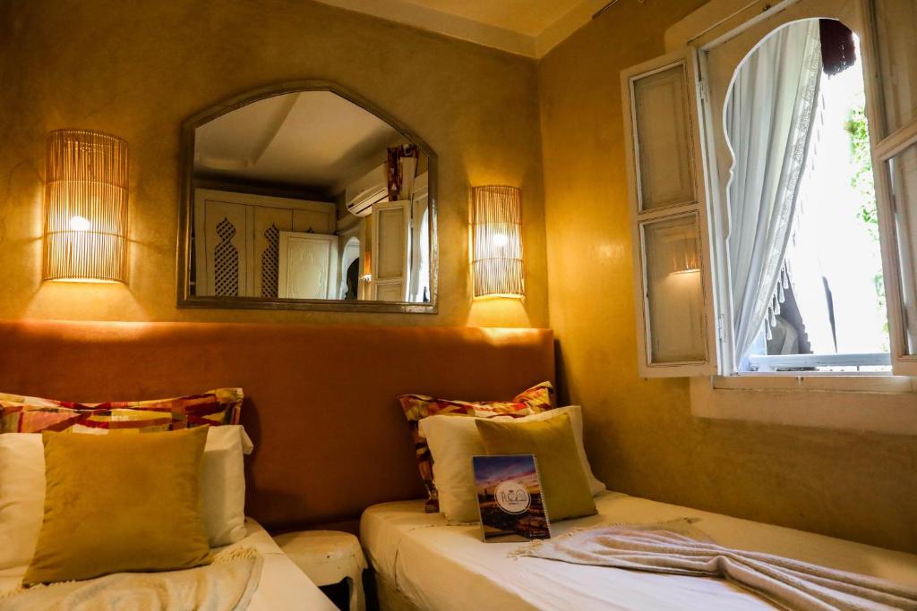 Postel nebo postele na pokoji v ubytování Riad les 2 Portes