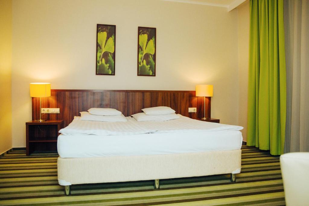 Postel nebo postele na pokoji v ubytování Hotel Ginkgo