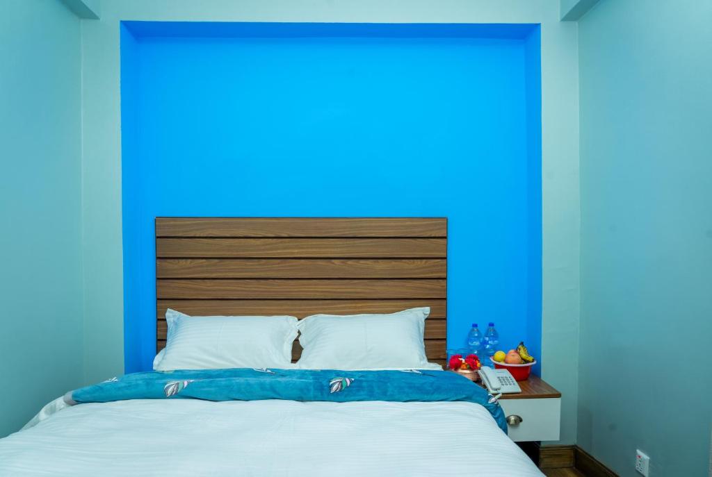 Postel nebo postele na pokoji v ubytování Hotel Nepal Bhumi