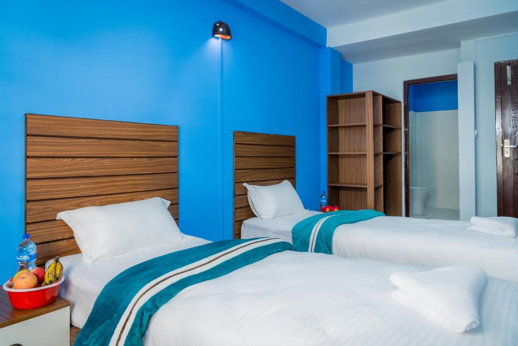 Postel nebo postele na pokoji v ubytování Hotel Nepal Bhumi