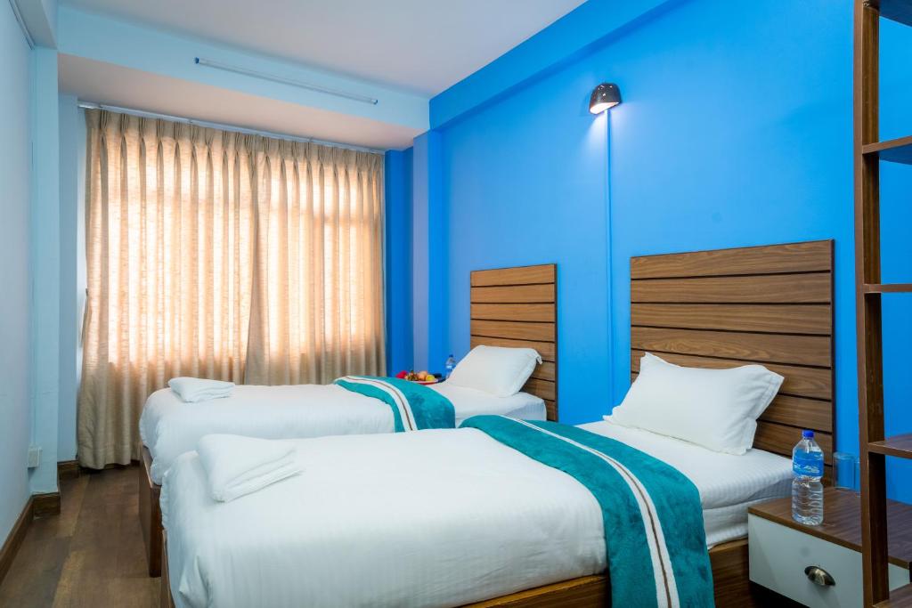 Postel nebo postele na pokoji v ubytování Hotel Nepal Bhumi