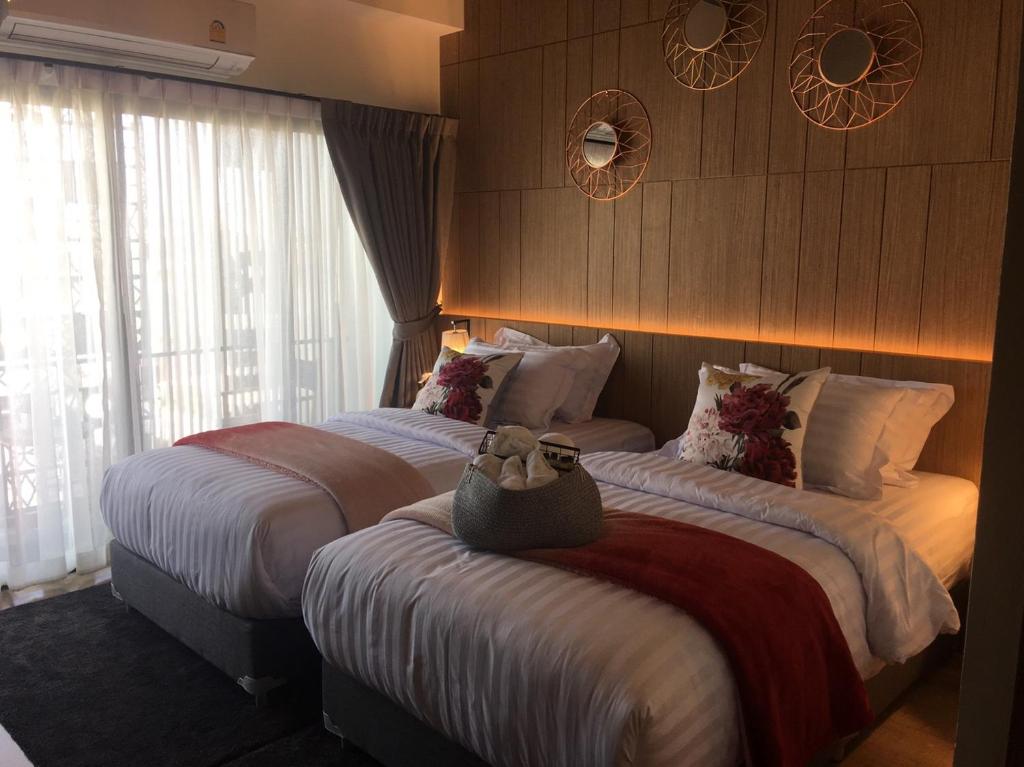 Postel nebo postele na pokoji v ubytování Tree​ for​ rest​ poshtel