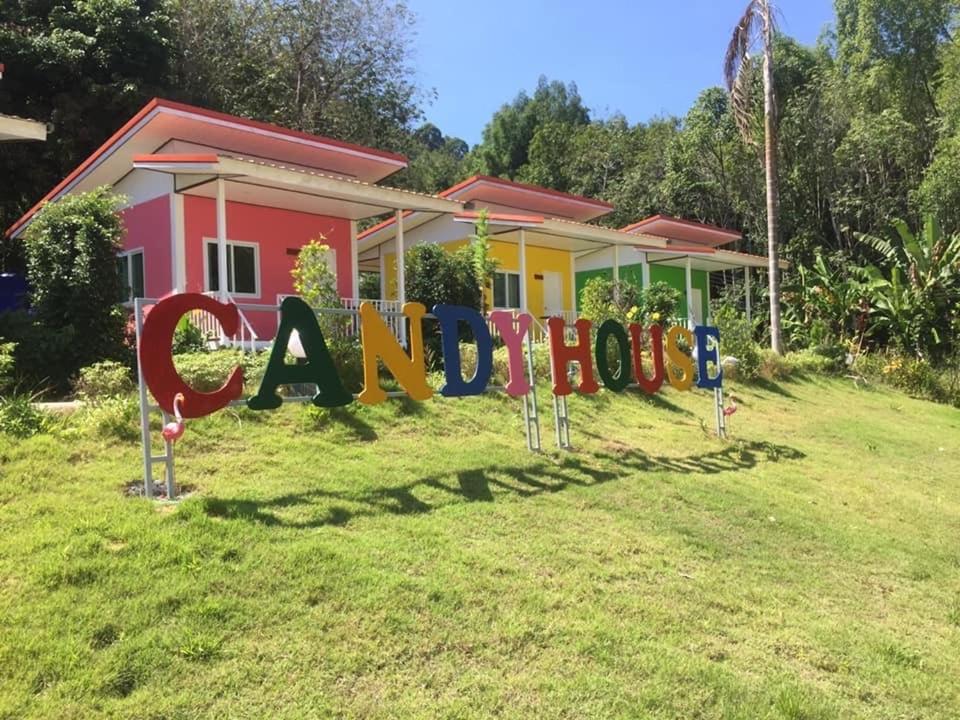 a house with a sign in front of it at Koh Yao Candy House in Ko Yao Yai