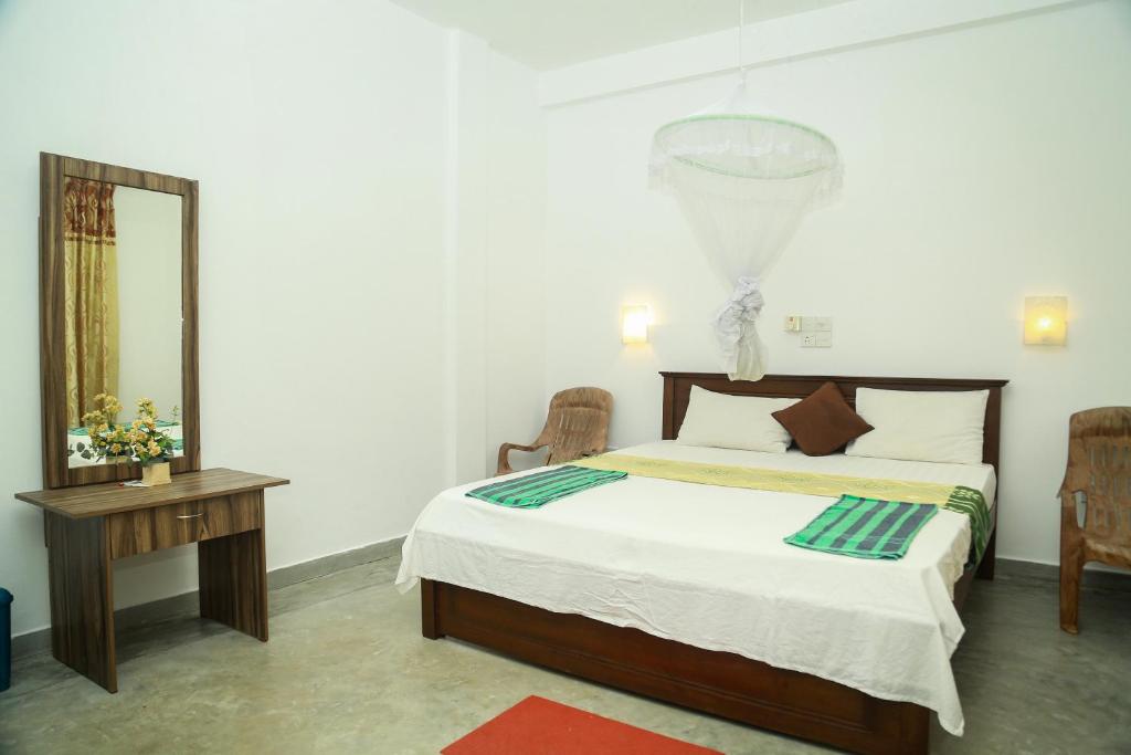 Postel nebo postele na pokoji v ubytování Suwa Arana Resort