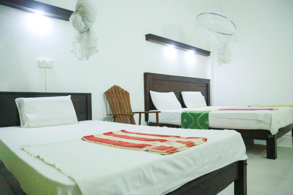 Postel nebo postele na pokoji v ubytování Suwa Arana Resort