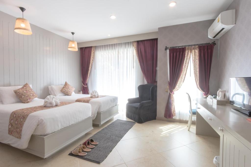 Postel nebo postele na pokoji v ubytování La Villa Boutique hotel
