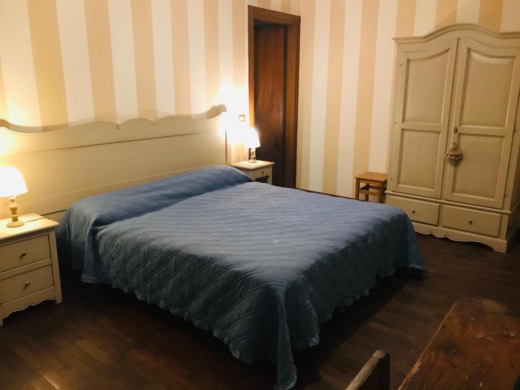 Letto o letti in una camera di B&B Al Ponte