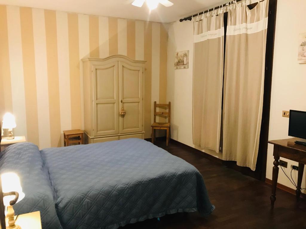 Letto o letti in una camera di B&B Al Ponte