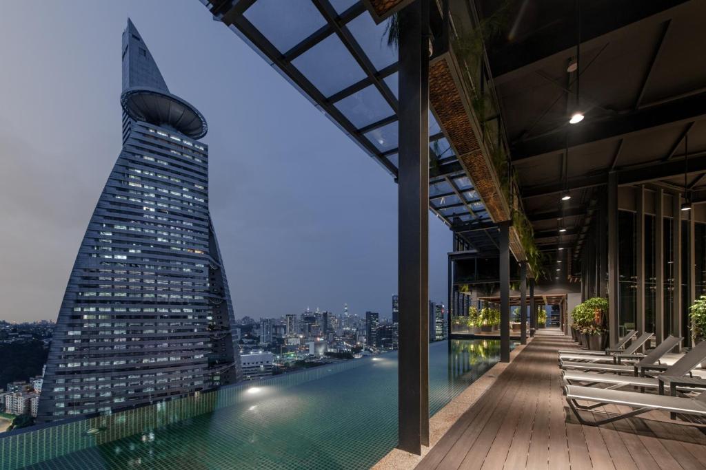 a view of the shard from the rooftop of a building at Komune Living in Kuala Lumpur