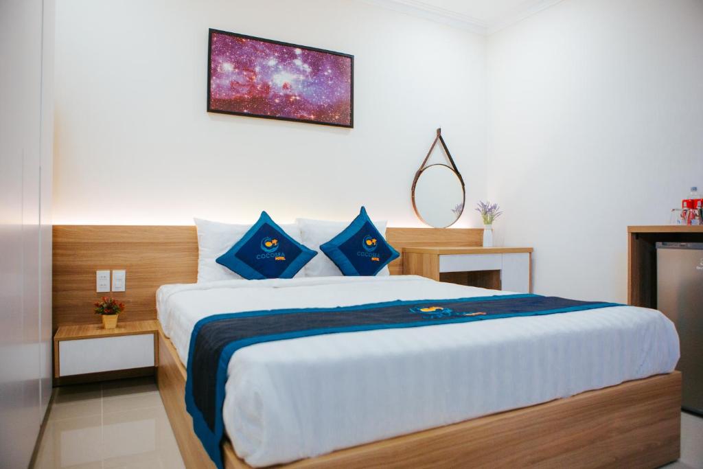 Postel nebo postele na pokoji v ubytování COCOSEA HOTEL