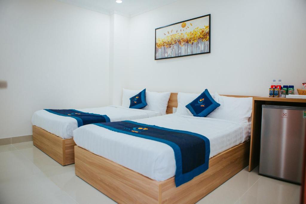 Postel nebo postele na pokoji v ubytování COCOSEA HOTEL