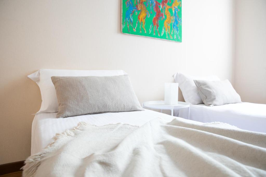 Postel nebo postele na pokoji v ubytování IseoLakeRental - Casa Anita