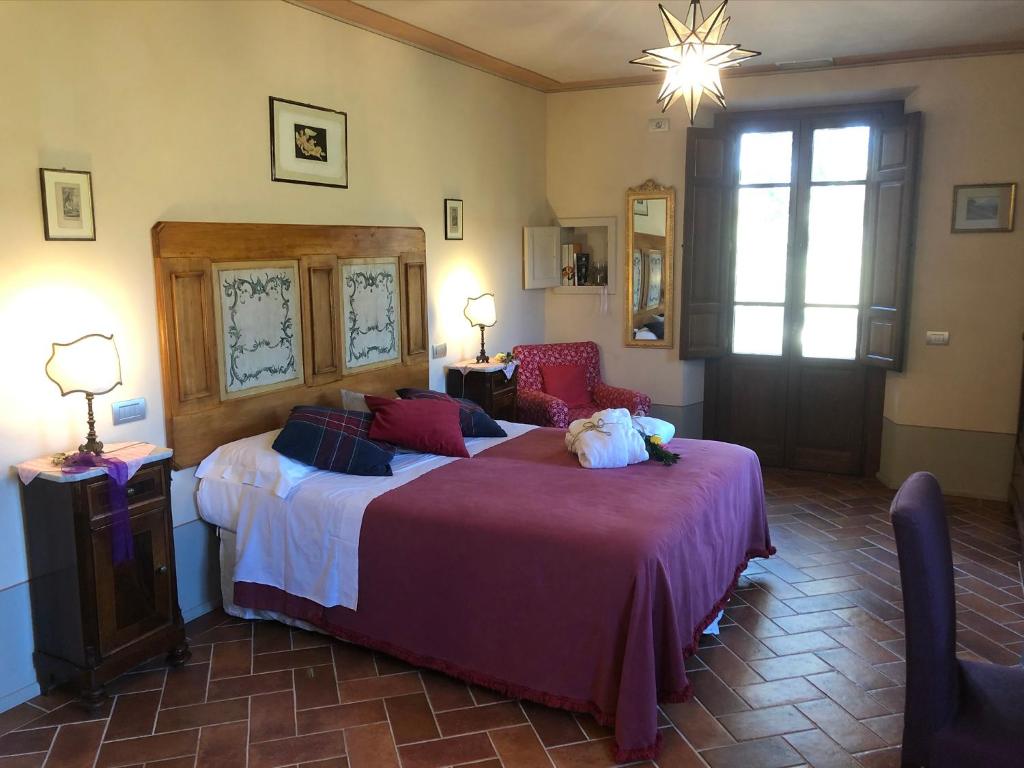 Posteľ alebo postele v izbe v ubytovaní La Cantina Relais - Fattoria Il Cipresso