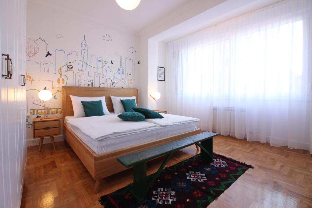 En eller flere senge i et værelse på Central Residence