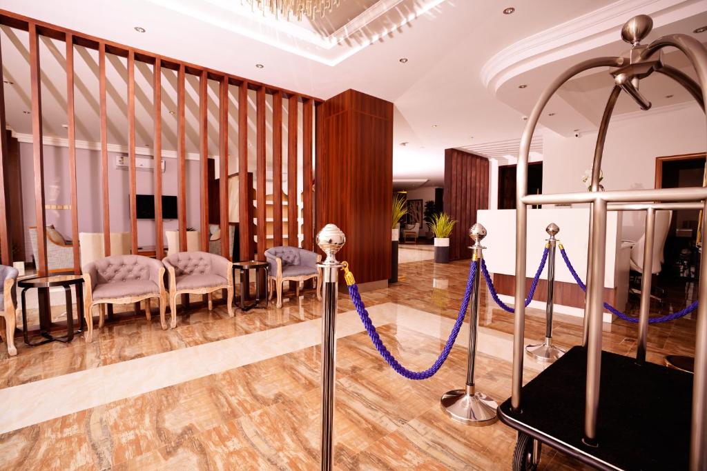 a salon with a blue rope in a room at Suite blue in Dammam