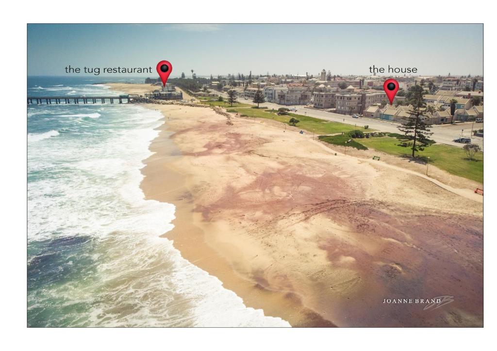 an aerial view of a beach with two hot air balloons at Bruckendorf Self Catering Apartment in Swakopmund