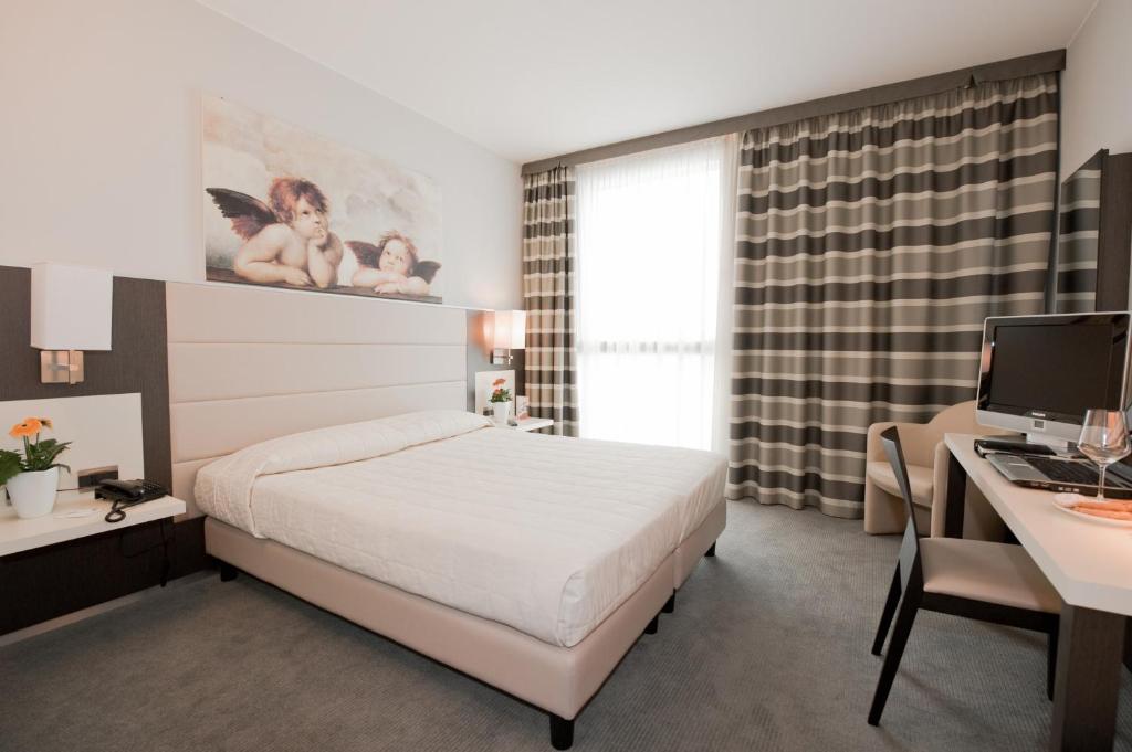 Llit o llits en una habitació de Hotel Rivarolo