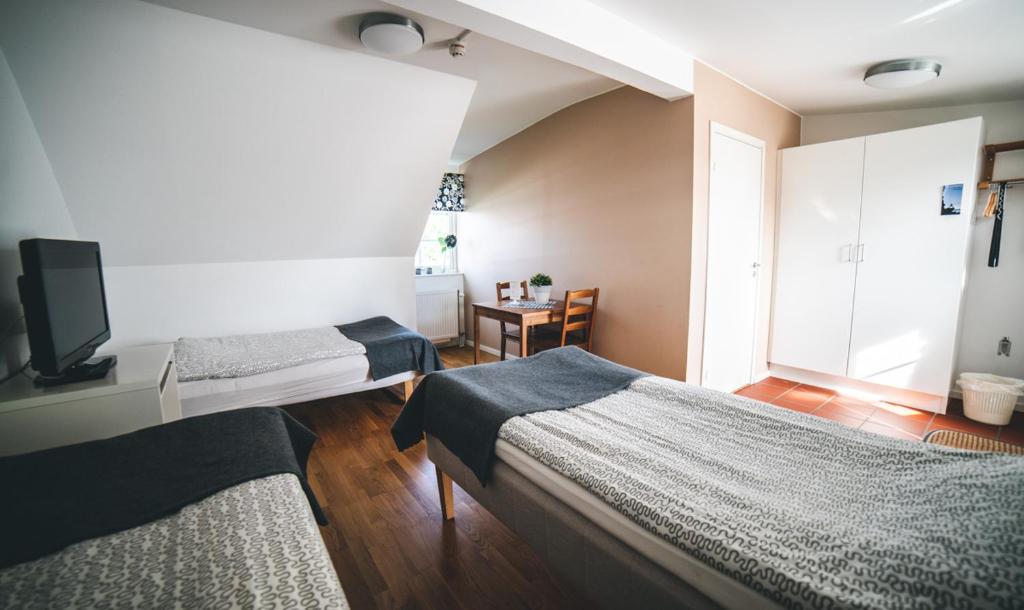 Postel nebo postele na pokoji v ubytování Hotell Vellingebacken