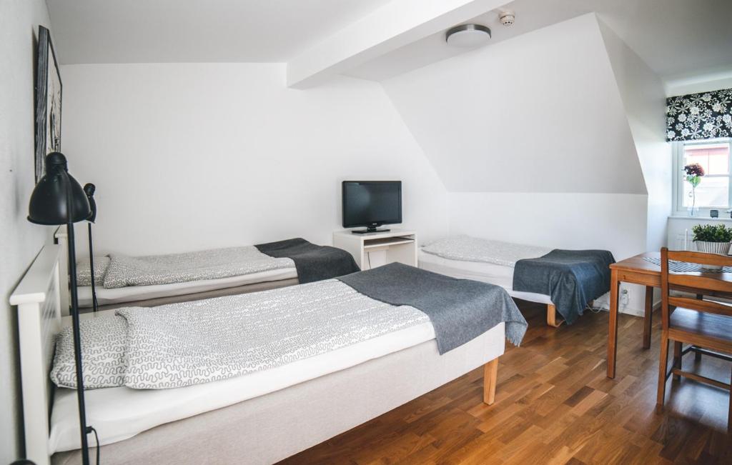 Postel nebo postele na pokoji v ubytování Hotell Vellingebacken