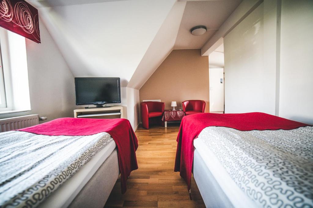 Postel nebo postele na pokoji v ubytování Hotell Vellingebacken