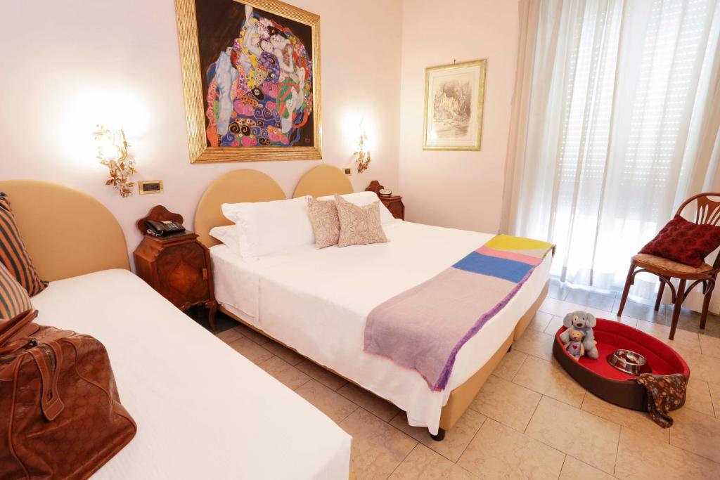Postel nebo postele na pokoji v ubytování Hotel Sant'Angelo