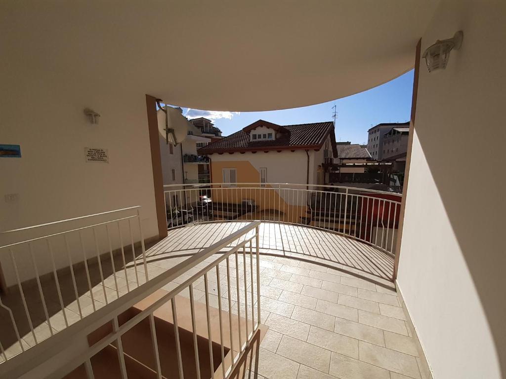 a balcony with a view of a building at San Marco Beach App Libeccio in Agropoli