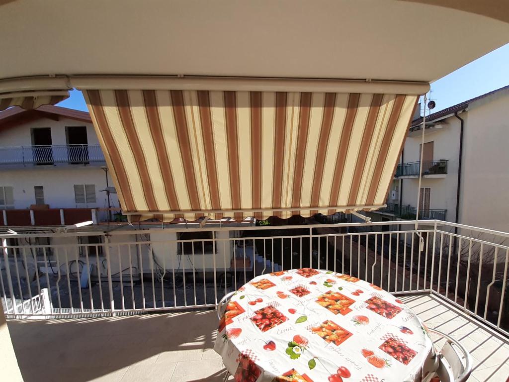 a balcony with a table with food on it at San Marco Beach App Libeccio in Agropoli