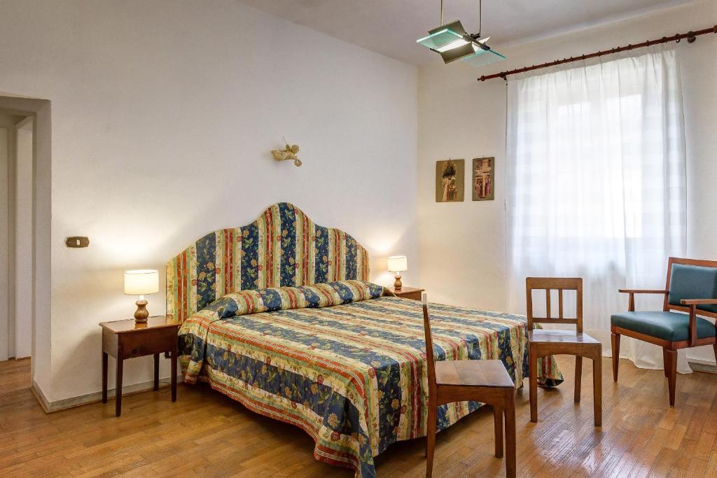 Postel nebo postele na pokoji v ubytování La Rocca