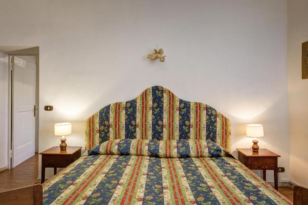 Postel nebo postele na pokoji v ubytování La Rocca