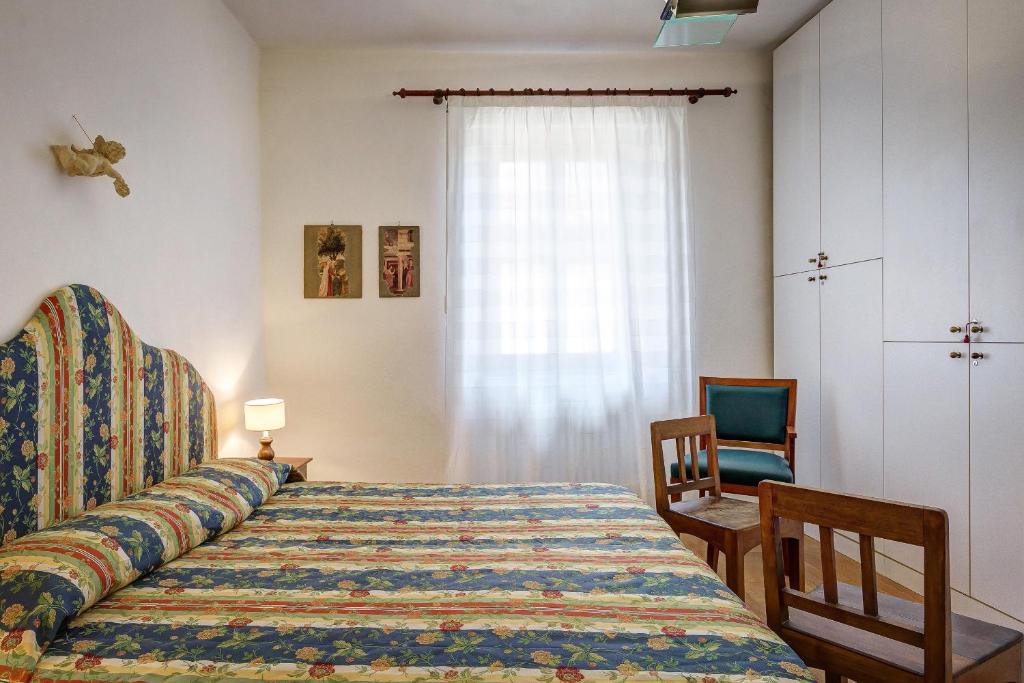 Postel nebo postele na pokoji v ubytování La Rocca