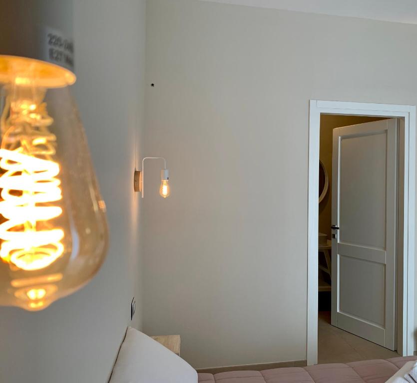 Łóżko lub łóżka w pokoju w obiekcie Enjoy Your Stay - Guest House - Olbia