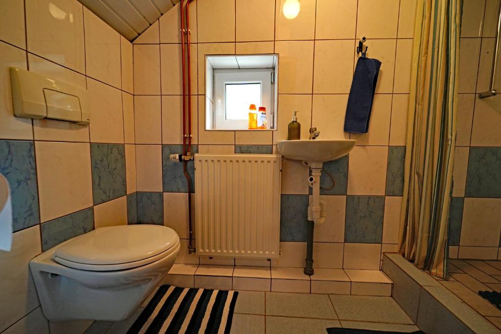 Koupelna v ubytování Room in Farmhouse Berkel