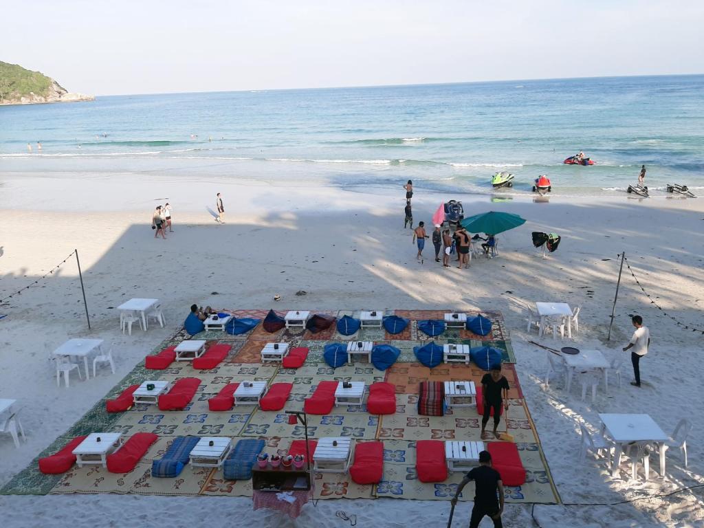 an overhead view of a beach with chairs and umbrellas at Sunrise Resort- Koh Phangan - SHA Extra Plus in Haad Rin