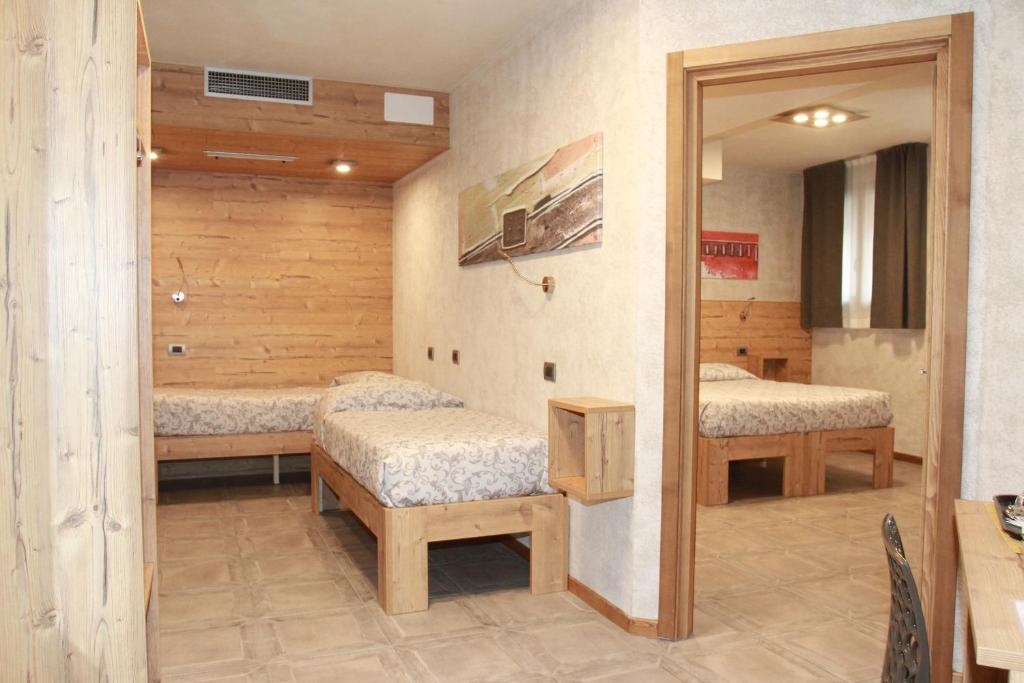 Postel nebo postele na pokoji v ubytování B&B Corte Rossa