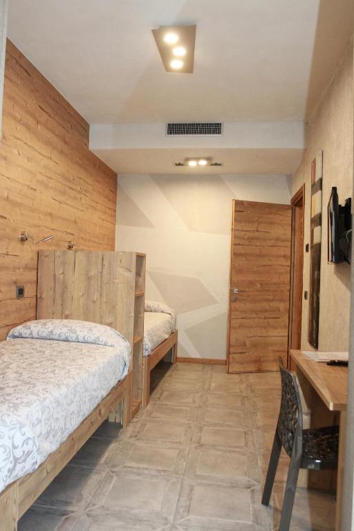 Postel nebo postele na pokoji v ubytování B&B Corte Rossa