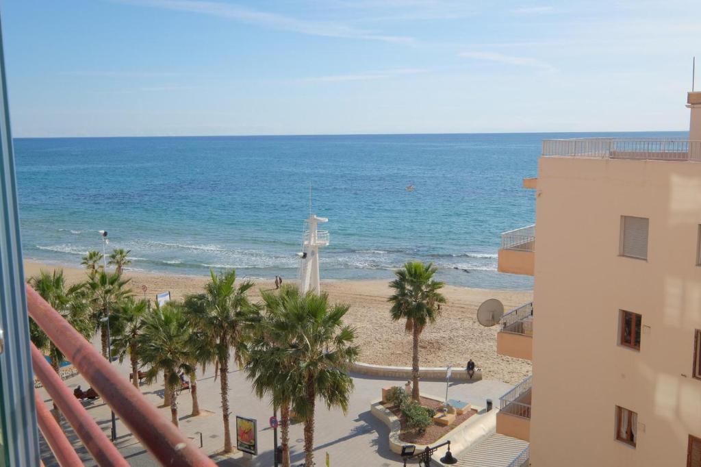 a view of the beach from the balcony of a building at Villa Fiorito in Calpe