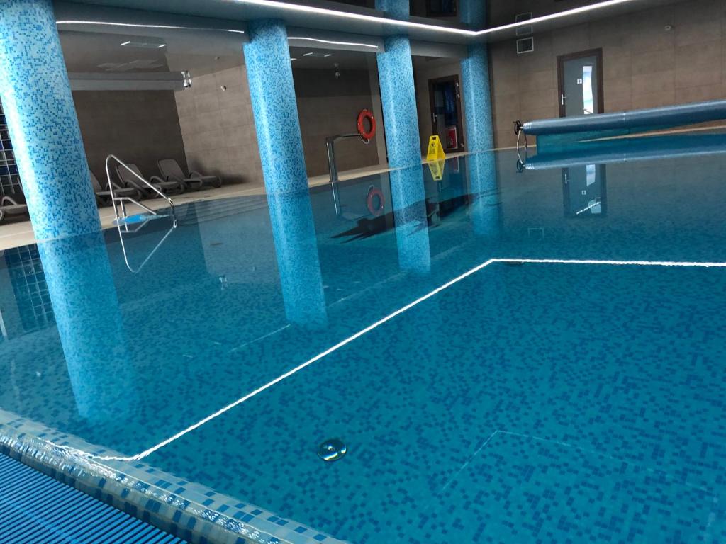 Bazén v ubytovaní Tasarz Spa Ośrodek Wczasowy alebo v jeho blízkosti