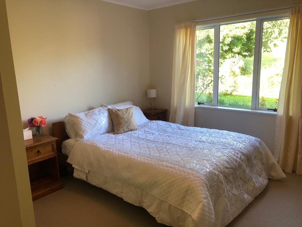 A bed or beds in a room at Rotorua Farm Stay