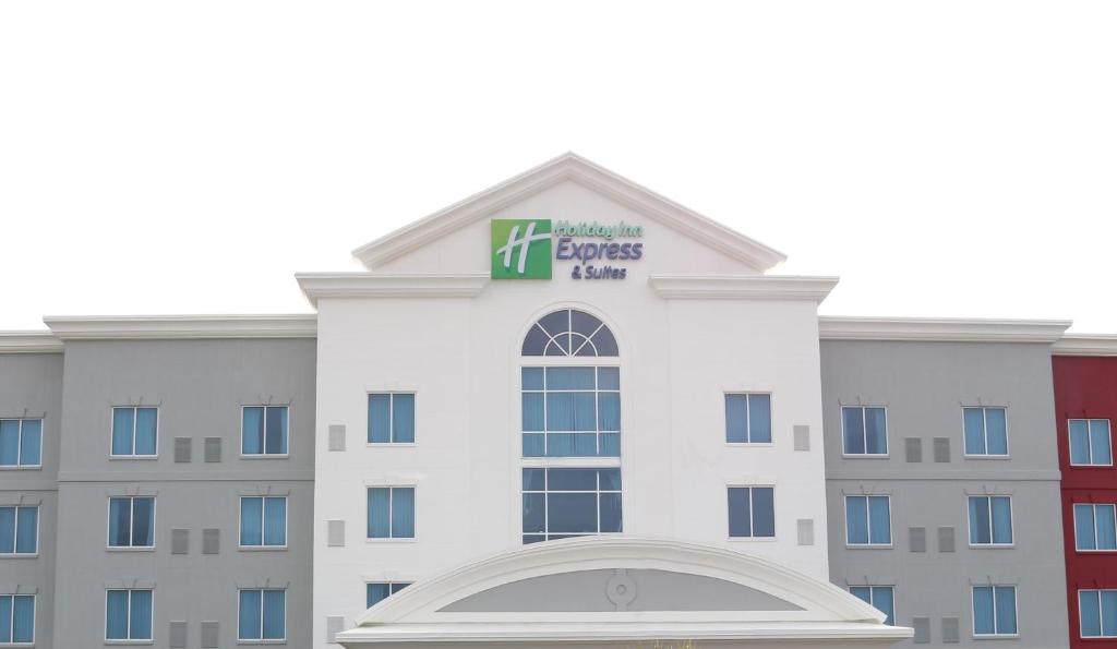 a large building with a sign on the front of it at Holiday Inn Express Hotel & Suites Columbia-Fort Jackson, an IHG Hotel in Columbia