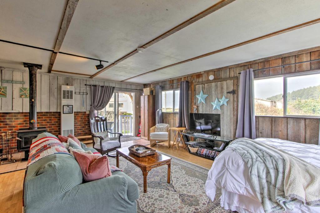 a living room with a bed and a couch at Sandy Toes Loft with Ocean Views in Moclips! in Moclips