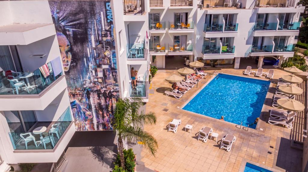 an overhead view of a swimming pool in a building at A Maos Hotel Apartments in Ayia Napa