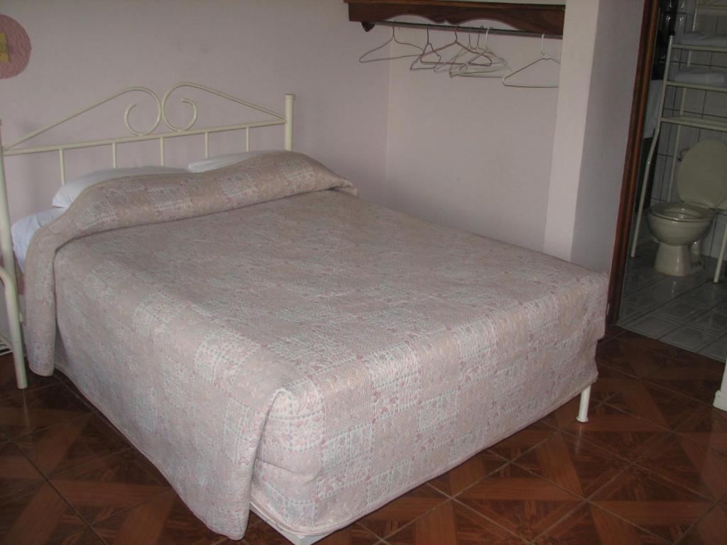 Postel nebo postele na pokoji v ubytování Hotel La Arena