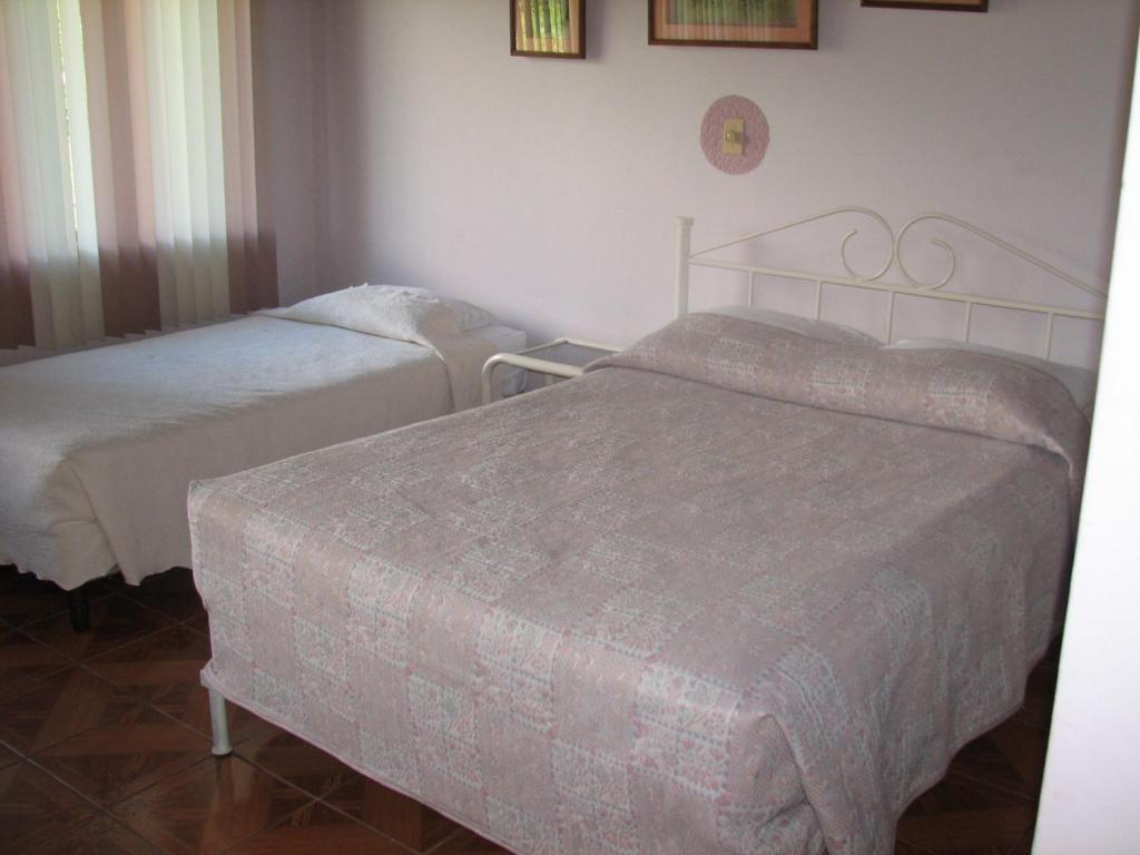 Postel nebo postele na pokoji v ubytování Hotel La Arena