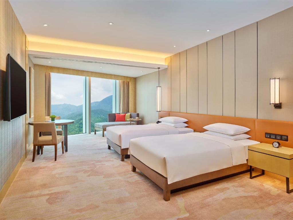 Postel nebo postele na pokoji v ubytování Hyatt Regency Shenzhen Yantian