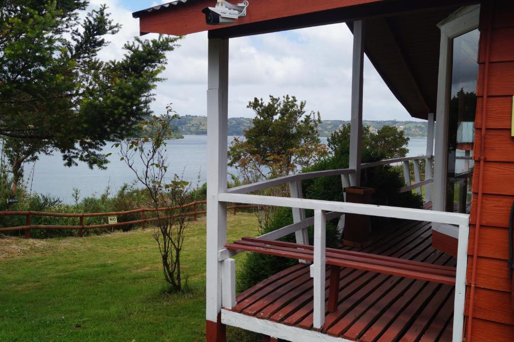 a porch of a house with a view of the water at Cabañas LLicaldad in Castro