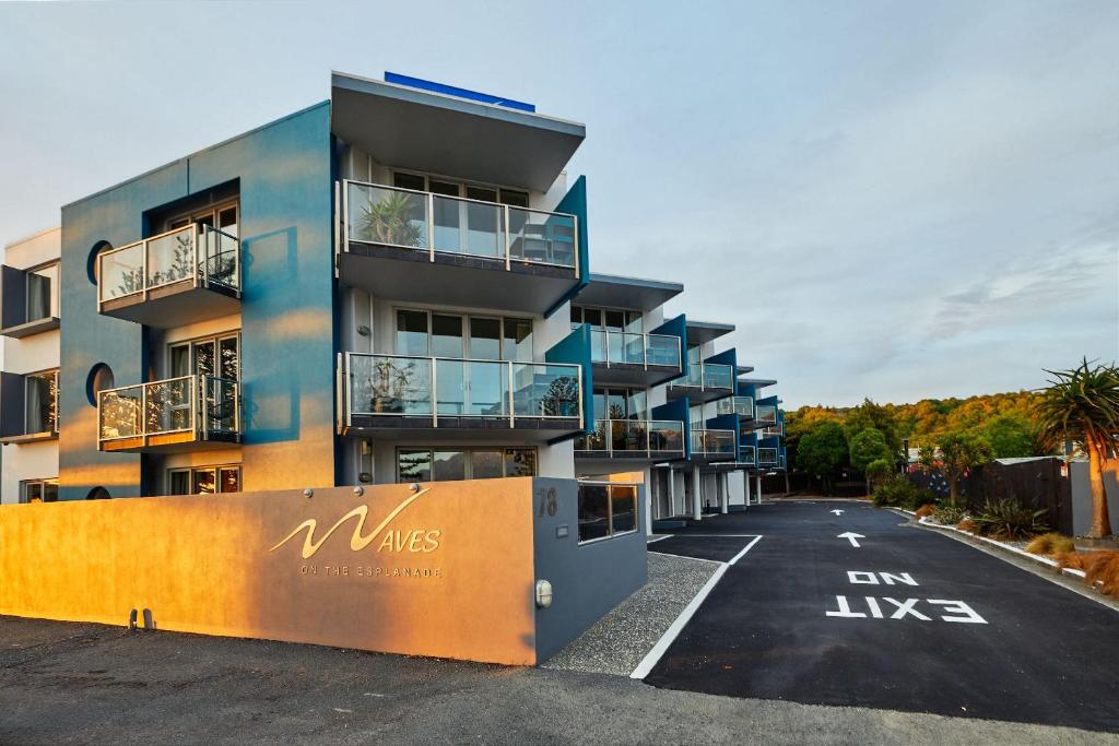 an apartment building with balconies on a street at Kaikoura Luxury Apartments - Formerly Waves Luxury Apartments in Kaikoura
